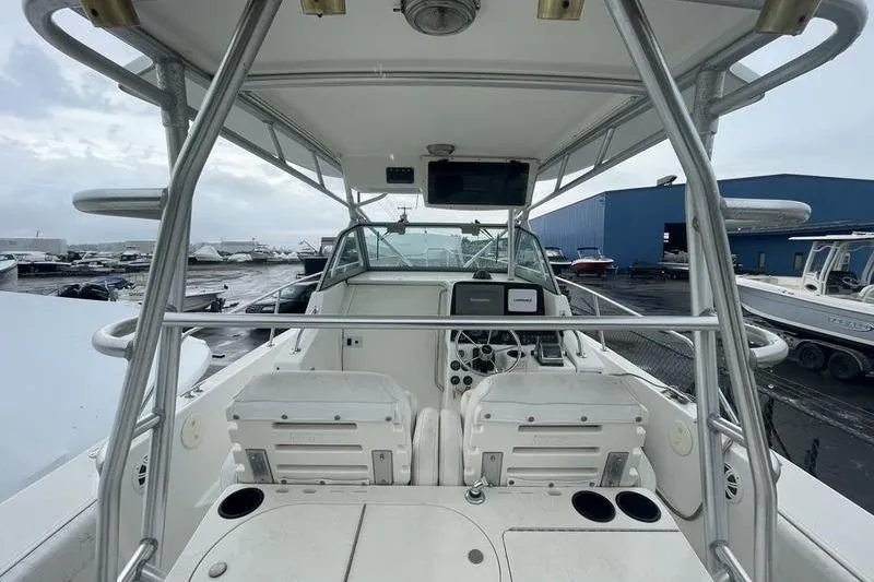 Slide: The Image of 2000 Boston Whaler 28 Outrage boat interior with helm and seating area. - 9