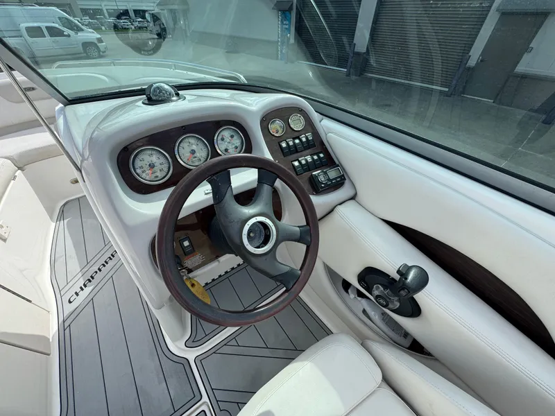 Slide: The Image of 2006 Chaparral 236 SSi boat dashboard with steering wheel and gauges. - 10