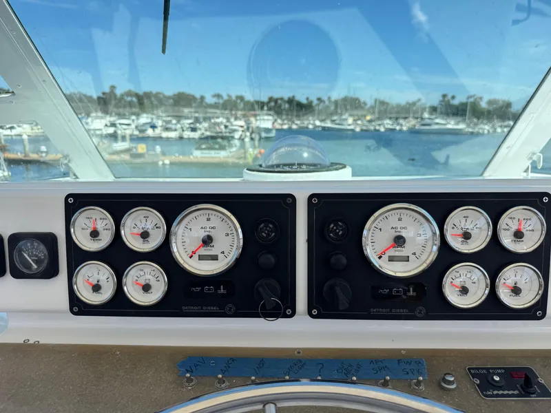 Slide: The Image of Control panel of a 1981 Bertram 58 Flybridge Motor Yacht with marina view. - 31