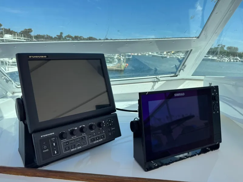 Slide: The Image of Navigation equipment on 1981 Bertram 58 Flybridge Motor Yacht, featuring Furuno and Simrad displays. - 37
