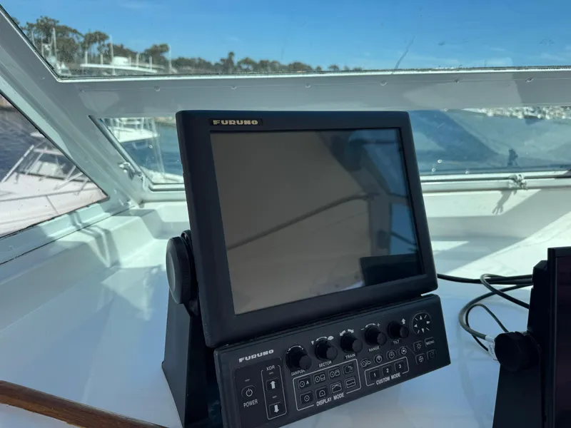 Slide: The Image of Furuno navigation system on 1981 Bertram 58 Flybridge Motor Yacht's helm. - 39