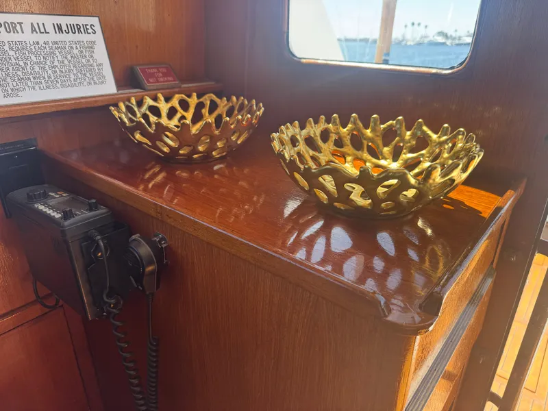 Slide: The Image of Golden decorative bowls on wooden surface inside 1981 Bertram 58 Flybridge Motor Yacht. - 7