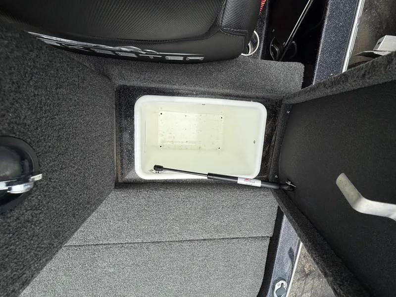 Slide: The Image of 2022 Skeeter ZX 150 boat storage compartment with open lid and hydraulic support. - 12