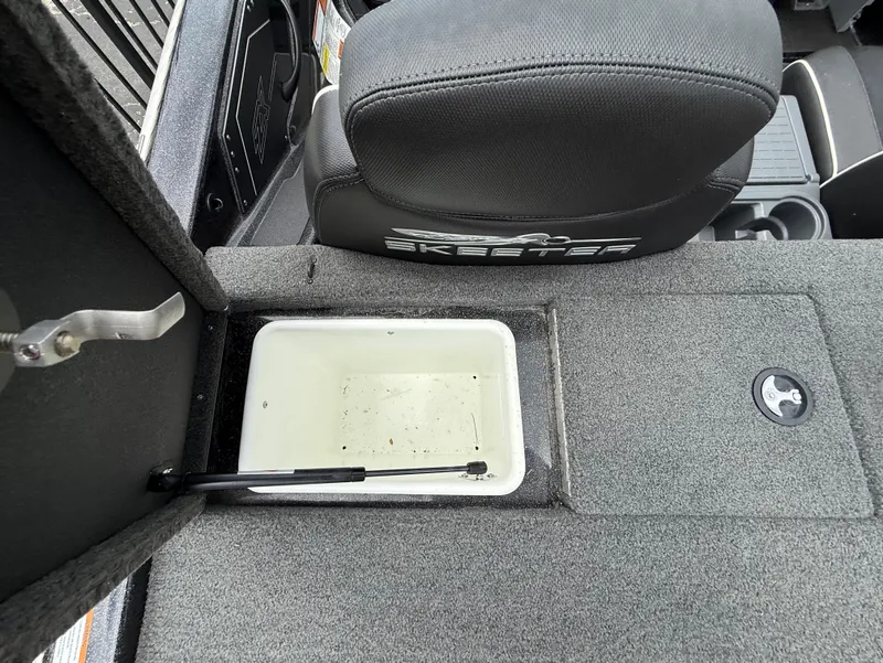 Slide: The Image of 2022 Skeeter ZX 150 boat interior with storage compartment and seat detail. - 15