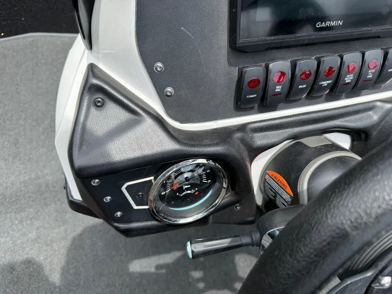 Slide: The Image of 2022 Skeeter ZX 150 dashboard with Garmin display and control switches. - 20