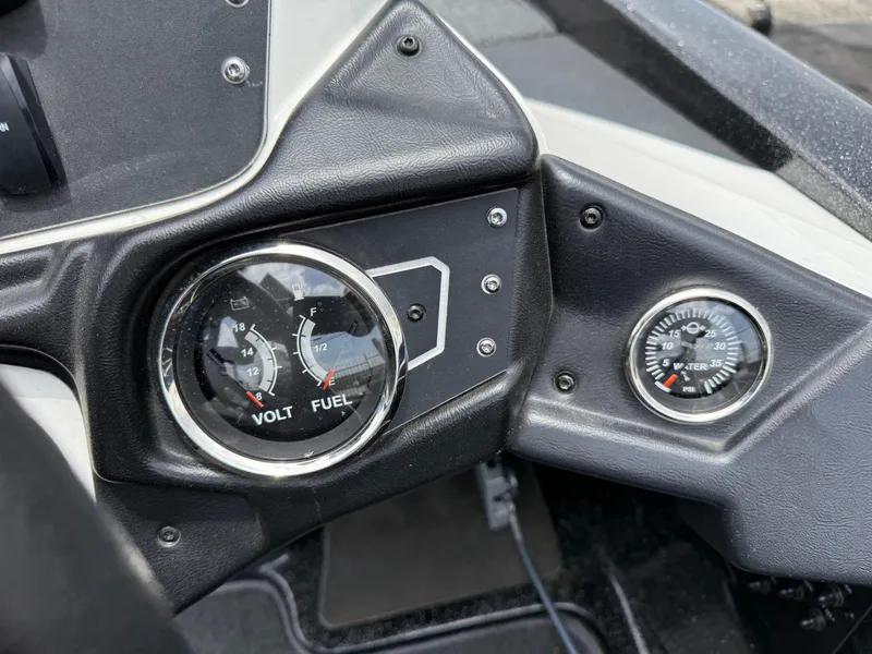 Slide: The Image of 2022 Skeeter ZX 150 dashboard with volt, fuel, and water pressure gauges. - 22