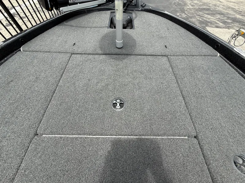 Slide: The Image of 2022 Skeeter ZX 150 boat deck with gray carpet and storage compartments. - 30