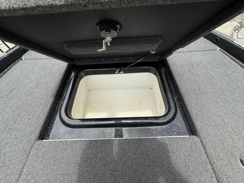 Slide: The Image of Open storage compartment in 2022 Skeeter ZX 150 boat, featuring a spacious interior. - 31