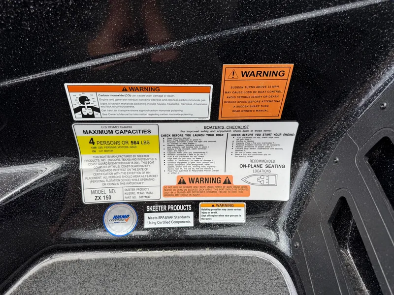 Slide: The Image of Warning labels and capacity information on a 2022 Skeeter ZX 150 boat. - 38