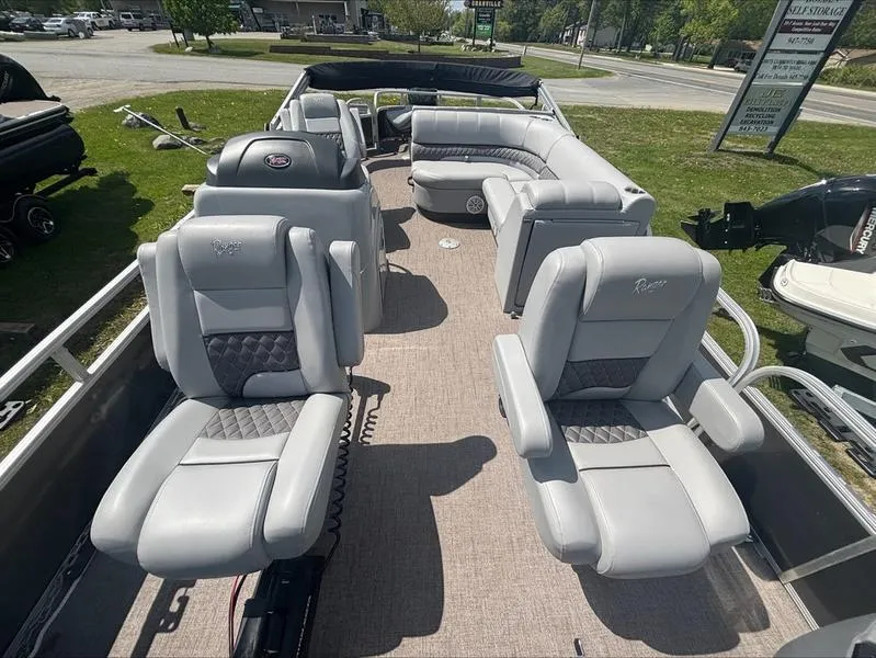 Slide: The Image of 2022 Ranger 220 F boat interior with luxurious gray seating and spacious layout. - 10