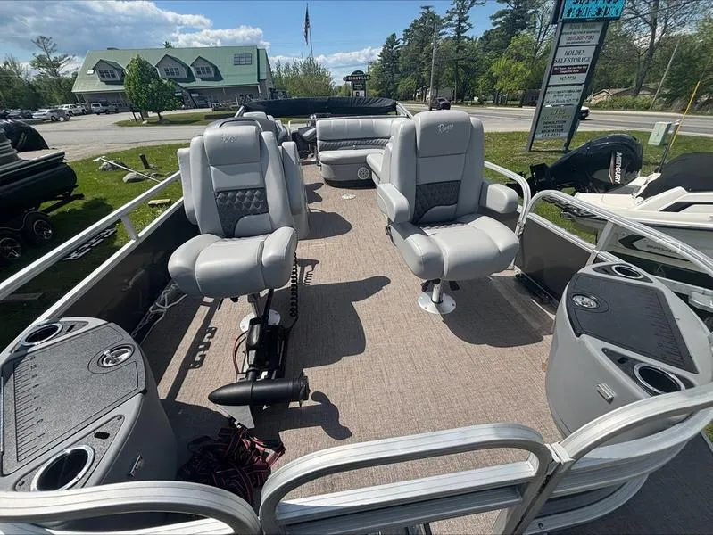 Slide: The Image of 2022 Ranger 220 F boat interior with gray seating and fishing equipment. - 4