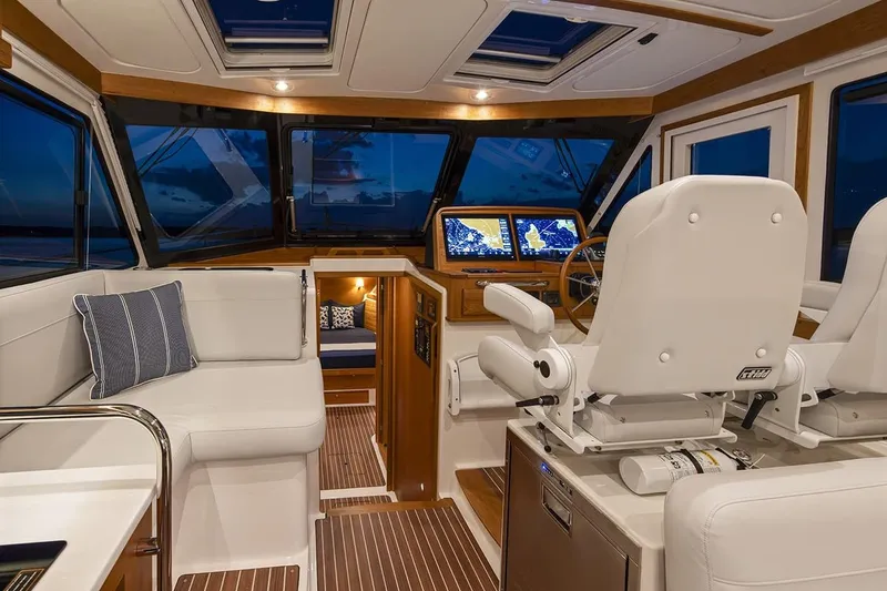 Slide: The Image of Luxurious interior of 2026 Back Cove 412 yacht with plush seating and advanced navigation displays. - 11