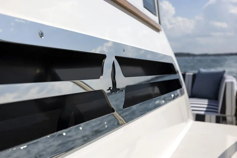 Slide: The Image of Close-up of 2026 Back Cove 412 yacht detail with ocean backdrop. - 6