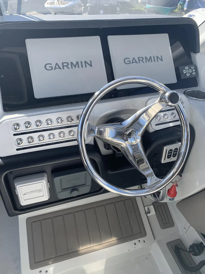 Slide: The Image of Interior of 2022 Finseeker 280 DC boat with seating and console. - 14