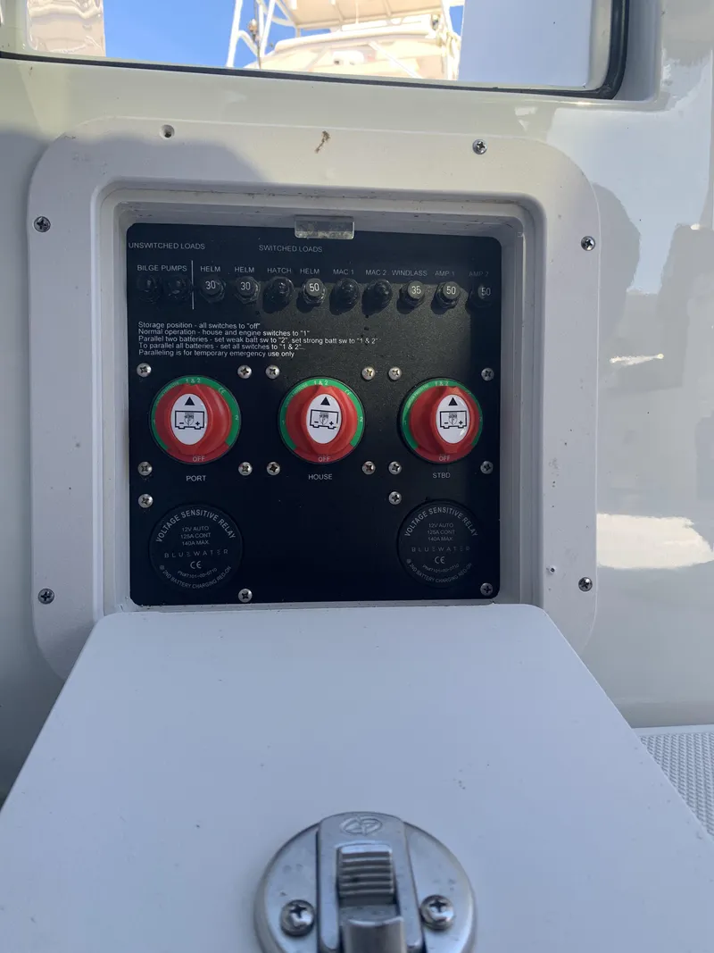 Slide: The Image of 2022 Finseeker 280 DC boat dashboard with dual Garmin displays and chrome steering wheel. - 20