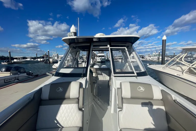 Slide: The Image of Interior view of 2022 Finseeker 280 DC boat docked at a marina. - 22