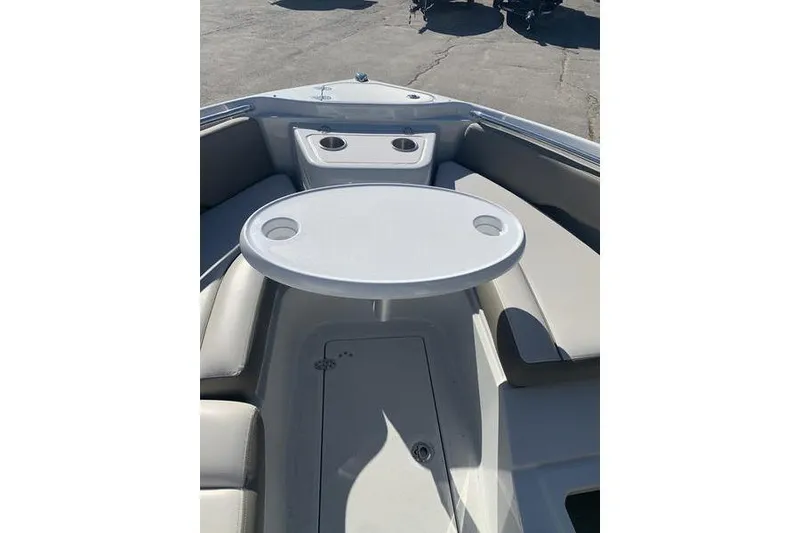 Slide: The Image of 2022 Finseeker 280 DC boat interior with round table and seating area. - 32