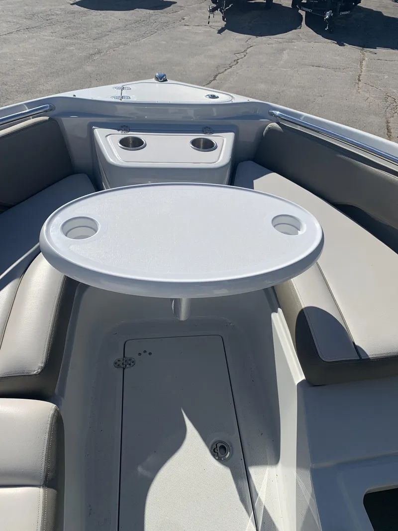 Slide: The Image of 2022 Finseeker 280 DC boat interior with seating and dual Mercury engines. - 8