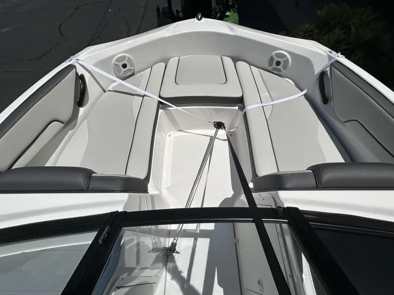 Slide: The Image of 2022 Yamaha Boats SX190 interior with white seating and speakers. - 10