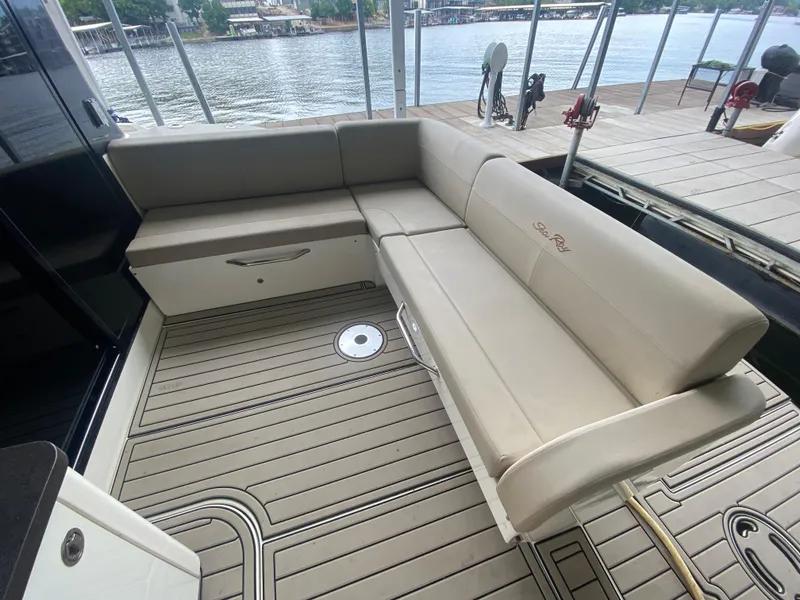 Slide: The Image of Luxurious seating area on 2015 Sea Ray 470 Sundancer yacht, docked by the water. - 13