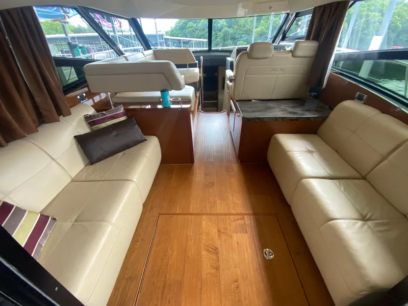 Slide: The Image of Luxurious interior of 2015 Sea Ray 470 Sundancer yacht with leather seating and wood flooring. - 15