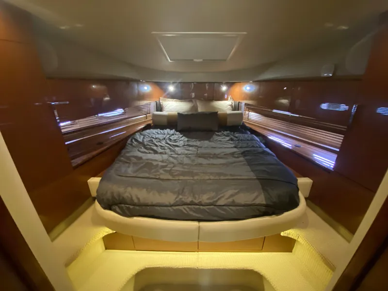 Slide: The Image of Luxurious cabin interior of 2015 Sea Ray 470 Sundancer yacht with cozy bedding. - 34