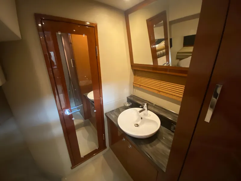 Slide: The Image of Luxurious bathroom interior of 2015 Sea Ray 470 Sundancer yacht with modern sink and mirror. - 41