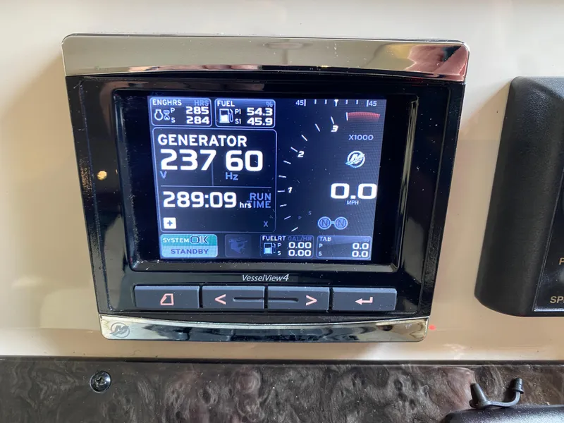 Slide: The Image of Display panel of a 2015 Sea Ray 470 Sundancer showing generator and engine data. - 48