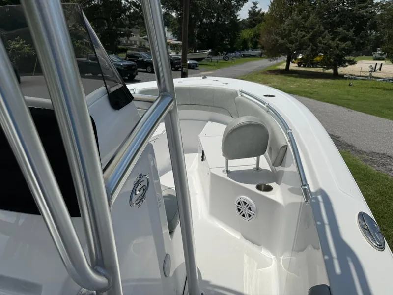 Slide: The Image of 2019 Sportsman Open 232 Center Console boat with seating and stainless steel railings. - 10