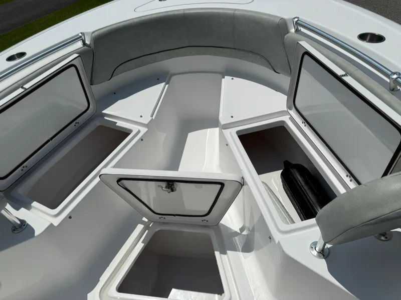 Slide: The Image of 2019 Sportsman Open 232 Center Console boat with open storage compartments. - 12