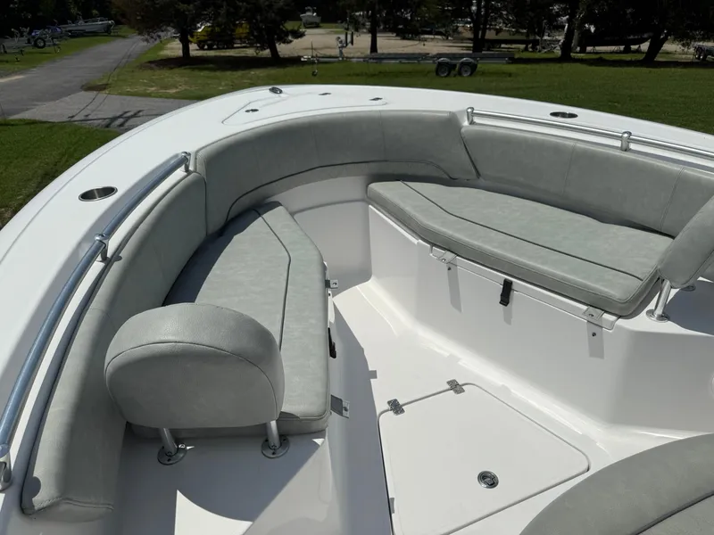 Slide: The Image of 2019 Sportsman Open 232 Center Console boat with cushioned seating area. - 15
