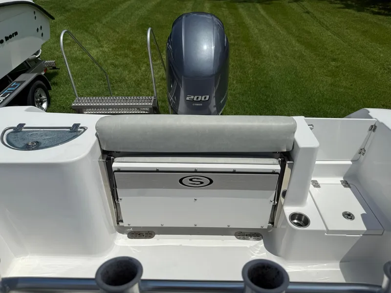 Slide: The Image of 2019 Sportsman Open 232 Center Console boat with Yamaha 200 engine, featuring seating and storage. - 16