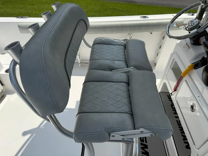 Slide: The Image of 2019 Sportsman Open 232 Center Console boat seating and steering wheel detail. - 19