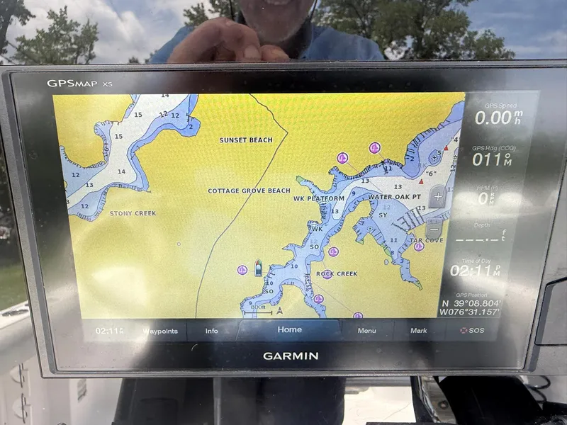 Slide: The Image of Garmin GPS display on 2019 Sportsman Open 232 Center Console, showing coastal map and navigation details. - 21