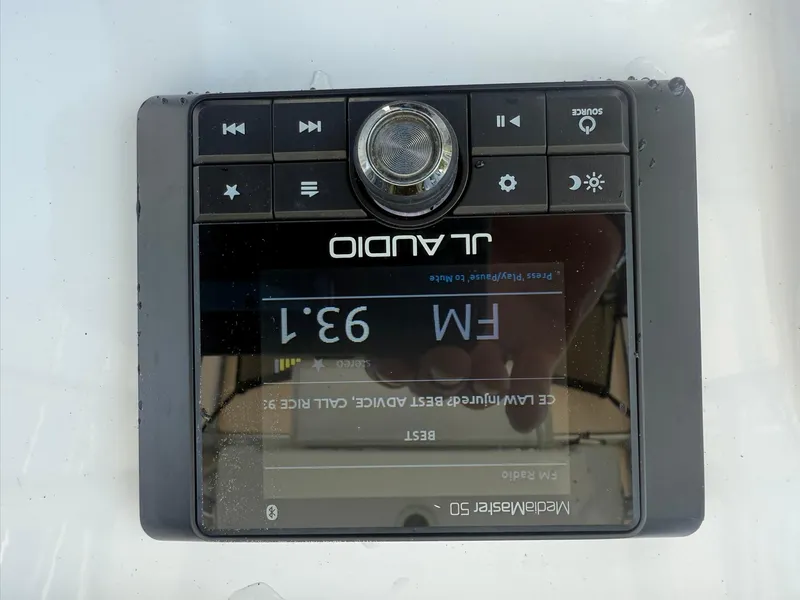 Slide: The Image of JL Audio MediaMaster 50 display on 2019 Sportsman Open 232 Center Console boat. - 24
