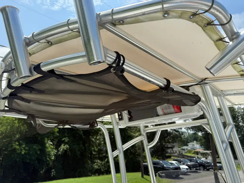 Slide: The Image of 2019 Sportsman Open 232 Center Console T-top with rod holders and storage net. - 26