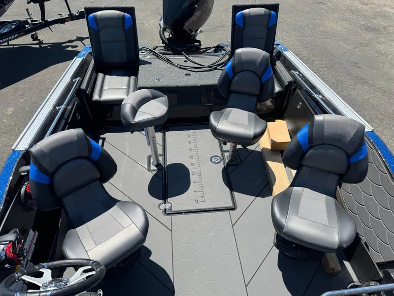 Slide: The Image of 2025 Nitro ZV20 Sport Pro boat interior with five cushioned seats and steering wheel. - 11