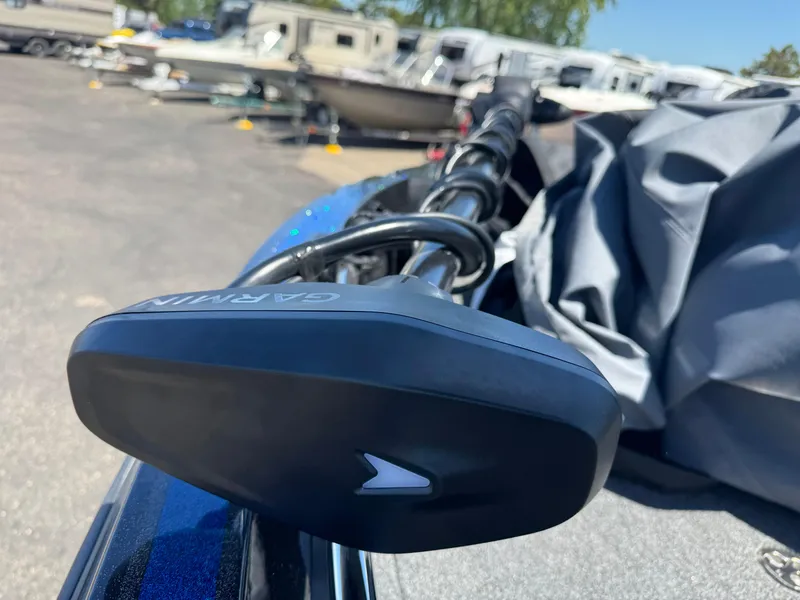 Slide: The Image of Garmin device on 2025 Nitro ZV20 Sport Pro boat, parked with other boats in background. - 12