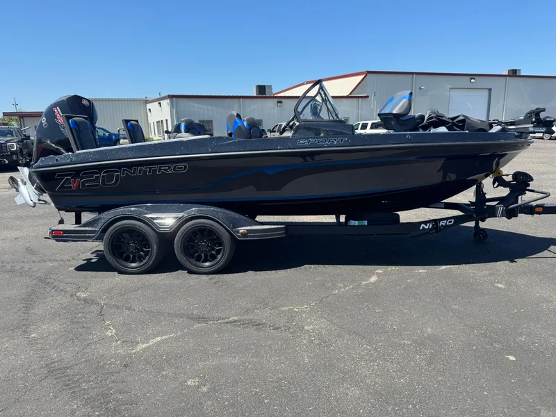 Slide: The Image of 2025 Nitro ZV20 Sport Pro boat on trailer, parked outdoors. - 3