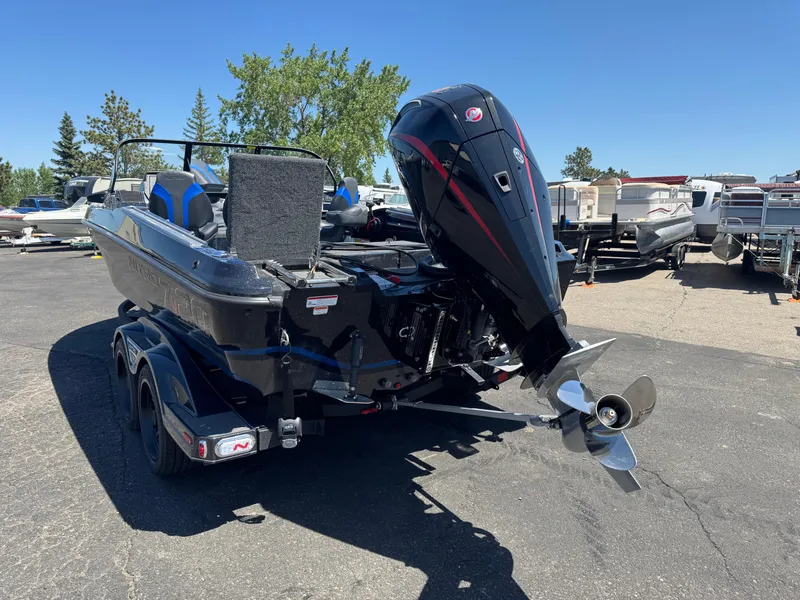 Slide: The Image of 2025 Nitro ZV20 Sport Pro boat with powerful outboard motor, parked on a trailer. - 5