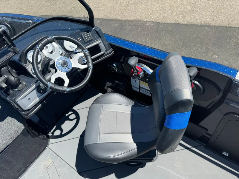 Slide: The Image of 2025 Nitro ZV20 Sport Pro boat cockpit with steering wheel and seat. - 8