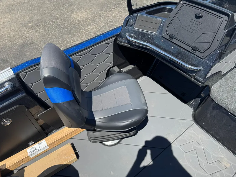 Slide: The Image of 2025 Nitro ZV20 Sport Pro boat interior with gray and blue seating. - 9