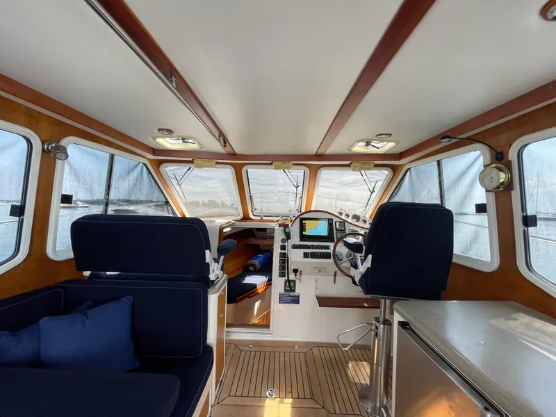 Slide: The Image of Interior of 2007 True North 38 boat with helm, seating, and navigation equipment. - 15