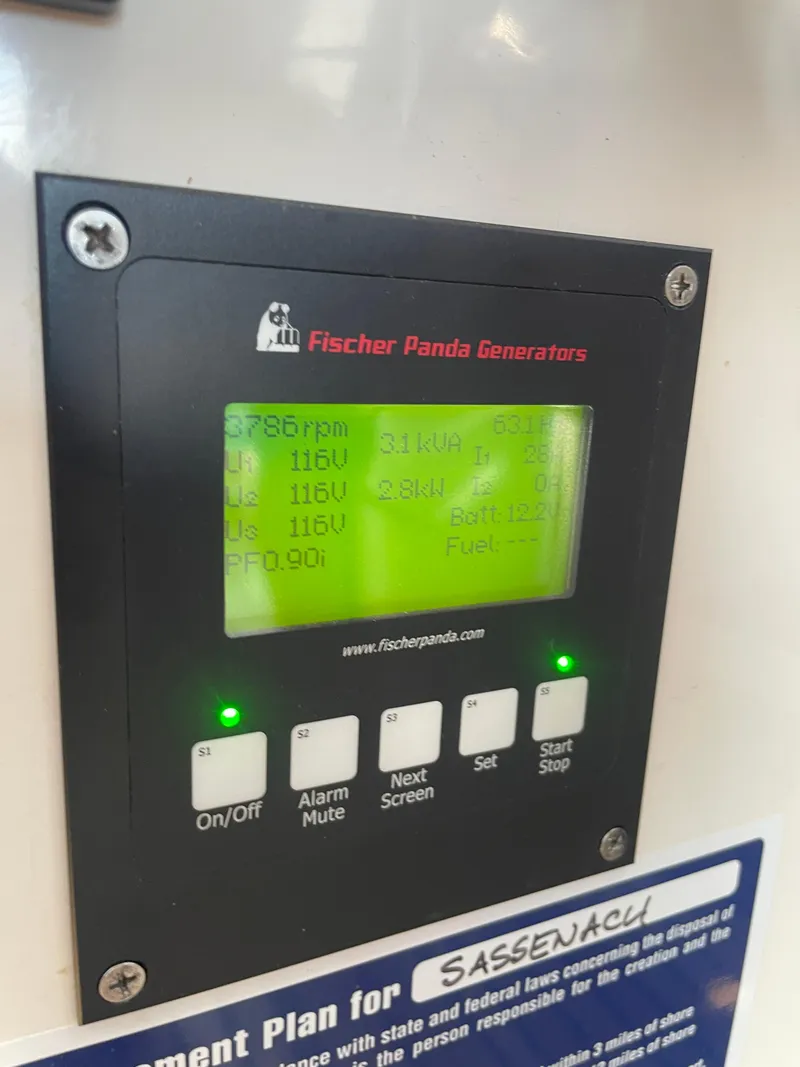 Slide: The Image of Fischer Panda generator control panel displaying voltage and power settings on a True North 38, 2007 model. - 22