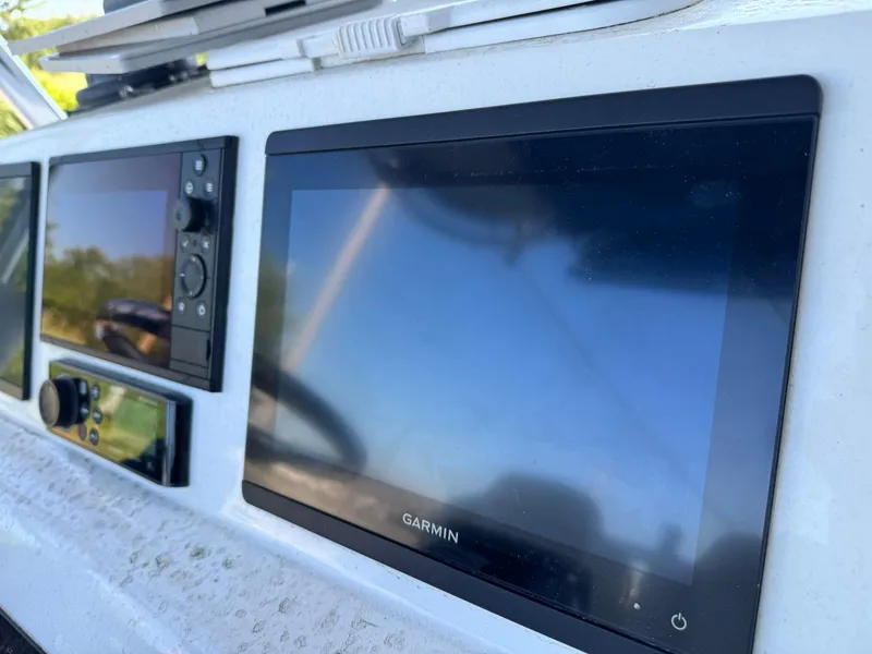 Slide: The Image of Garmin navigation system on 1998 Wellcraft Scarab Sport 302 boat dashboard. - 13