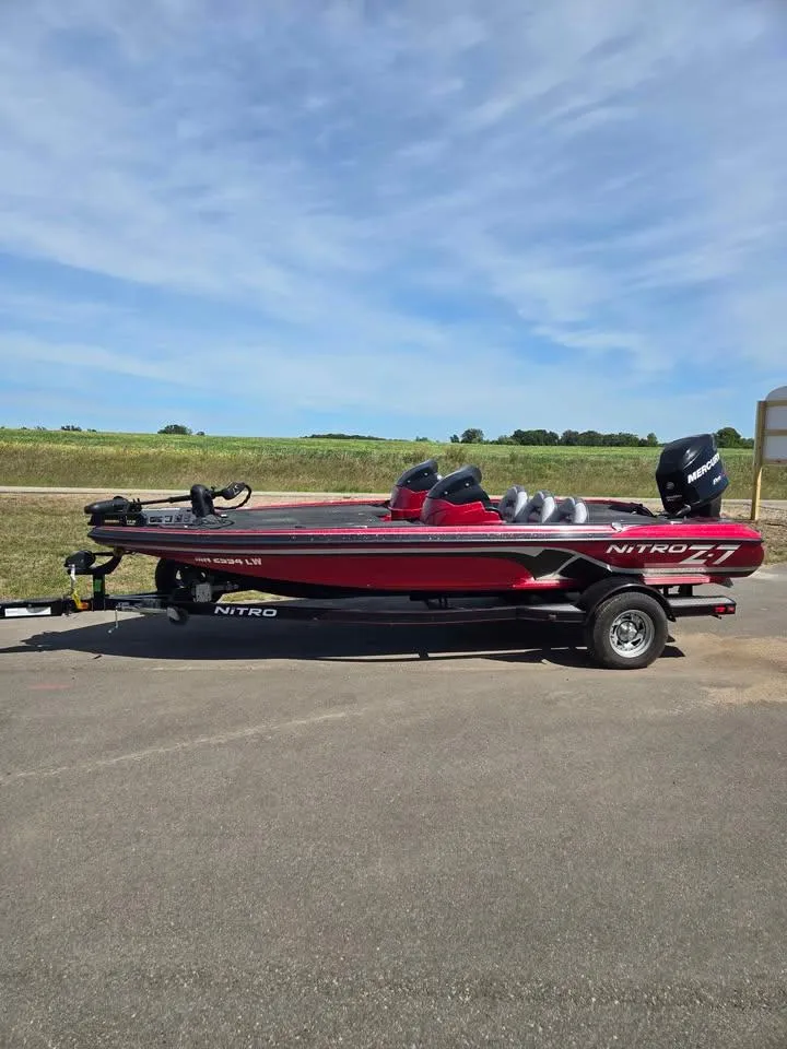 The Image of 2011 Nitro Z-7 boat with 150 L OptiMax Pro XS engine on trailer, parked outdoors. - 0