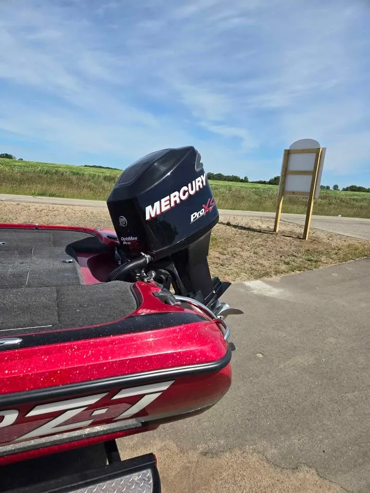 Slide: The Image of 2011 Nitro Z-7 boat with Mercury OptiMax Pro XS engine on a sunny day. - 1