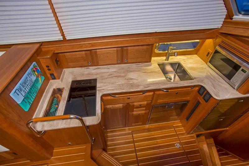 Slide: The Image of Luxurious interior of 2026 Sabre 45 Salon Express yacht with wood finish and modern amenities. - 11