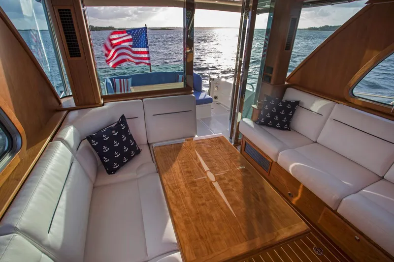Slide: The Image of Luxurious interior of 2026 Sabre 45 Salon Express yacht with elegant seating and wooden finishes. - 7