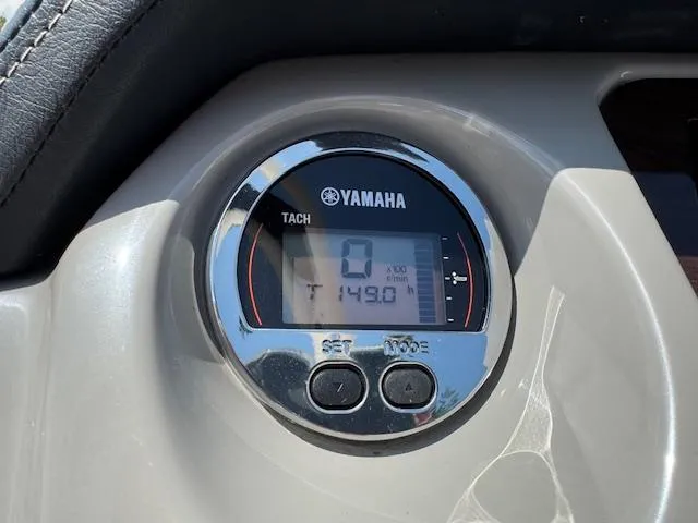 Slide: The Image of Yamaha tachometer on 2017 Chaparral 250 Suncoast boat dashboard, displaying 1490 RPM. - 12